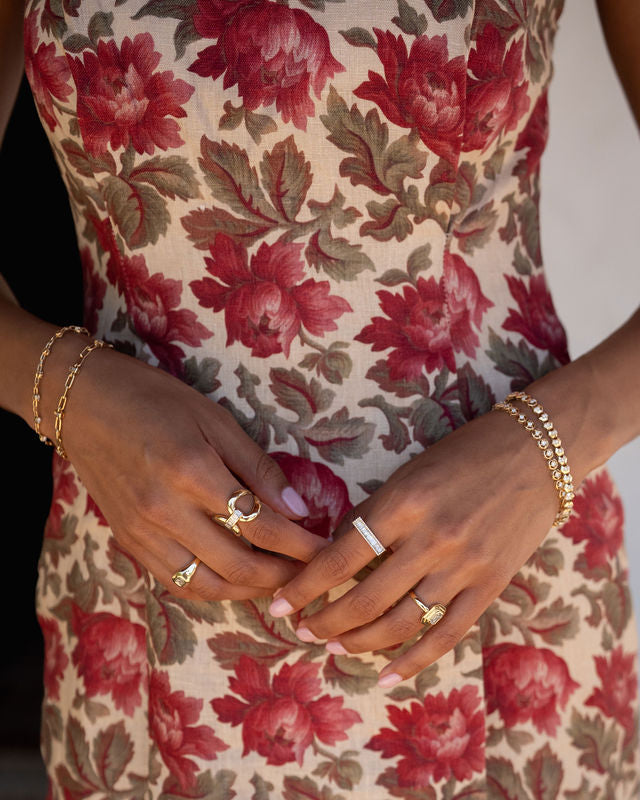 Solid Gold Stirrup Ring with Baguette Detail